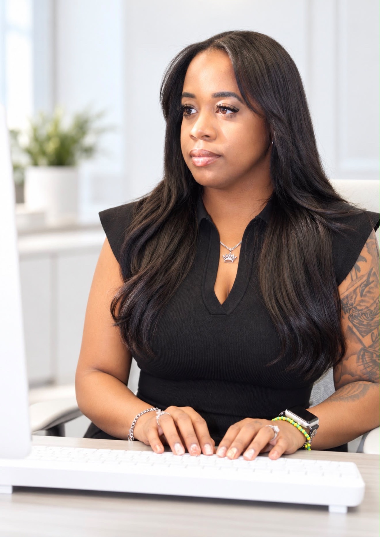 Owner of Cisneros Multi-Services working at her desk